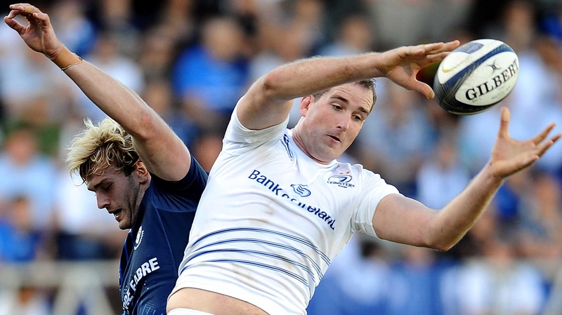 Leinster lock Devin Toner grabs the ball in a line out next to Castres' Richie Gray