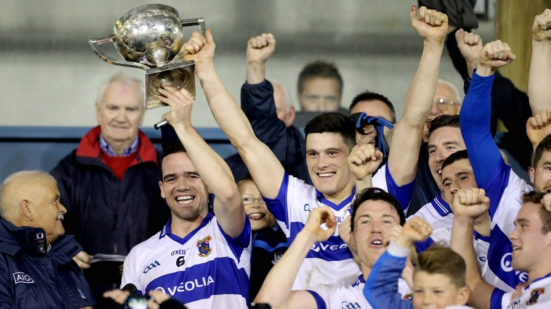 Ger Brennan and Diarmuid Connolly lift the trophy