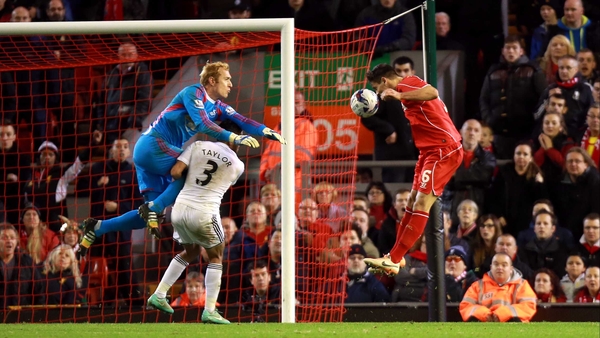 Dejan Lovren heads Liverpool into the Capital One Cup quarter-finals