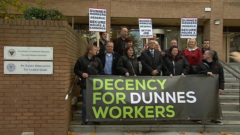 Dunnes Stores employees are seen at an October protest
