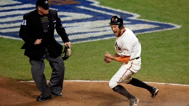 Hunter Pence of the San Francisco Giants celebrates after scoring against the Kansas City Royals during game five of the World Series in San Francisco