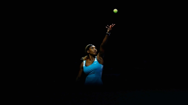 Serena Williams serves against Simona Halep during the WTA Finals in Singapore