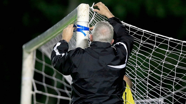 A groundsman fixes the net at the UCD Bowl at Belfield in Dublin