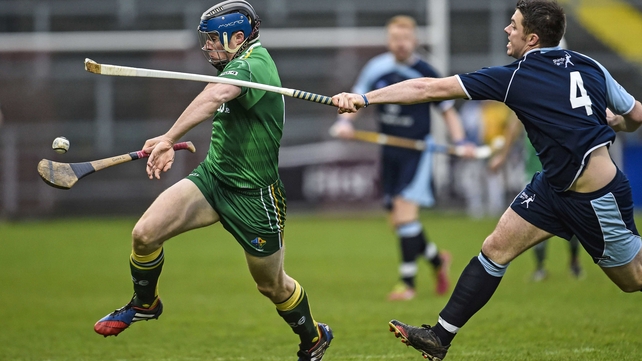 Ireland's Conor Lehane under pressure from Steven MacDonald of Scotland during the hurling/shinty international in Newry