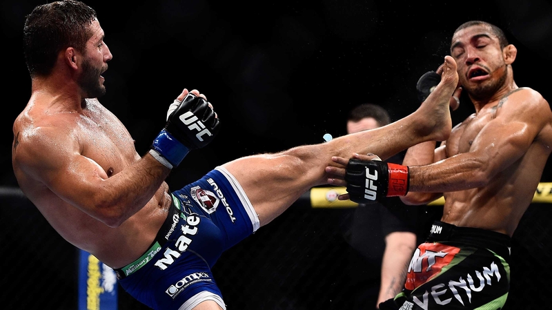 Chad Mendes of the US kicks Jose Aldo of Brazil in their UFC featherweight bout at the Maracanazinho in Brazil