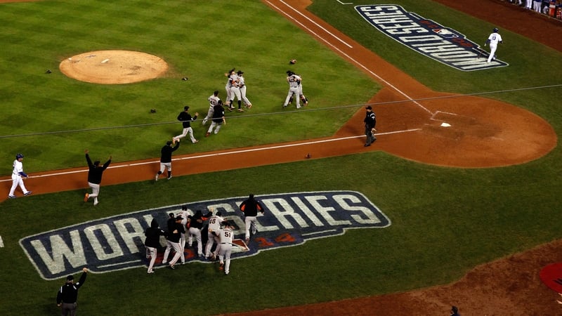 The Giants storm the field after Bumgarner gets the final out