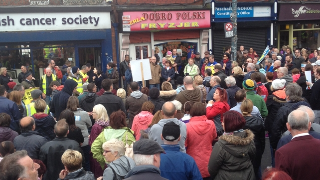 Demonstrators listen to speeches in Phibsboro