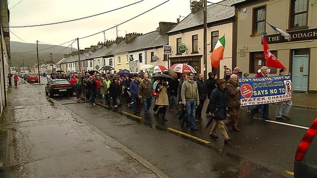 Protesters make their way through Portlaw, which is the home town of Minister of State Paudie Coffey