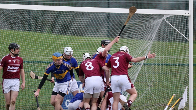 A goal-mouth scramble as Portaferry and Cushendall players battle for the ball