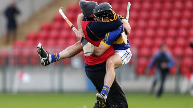 Portaferry's Ciaran Coulter celebrates with team mentor Joe Kelly at the final whistle after their Ulster SHC final victory over Cushendall