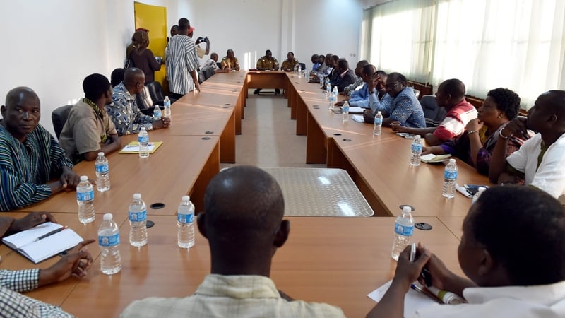 Lieutenant Colonel Isaac Zida (C) chairs a meeting between the army and opposition leaders in Ouagadougou