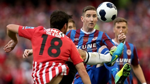 Saints left-back Ian Bermingham keeps his eye on the ball