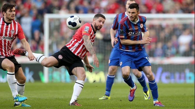 Killian Brennan and Rory Patterson tussle for possession