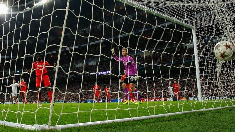 Kolo Toure and Simon Mignolet appeal for an offside decision that doesn't come