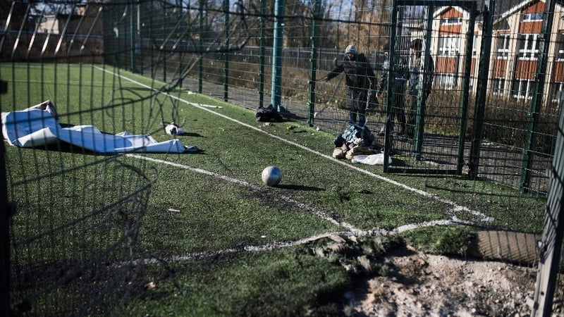 A football is seen on a playing field at a school which was shelled during fighting near Donetsk's former international airport