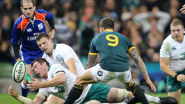 Peter O'Mahony and Robbie Henshaw try to get hands on the ball as Francois Hougaard of South Africa looks on