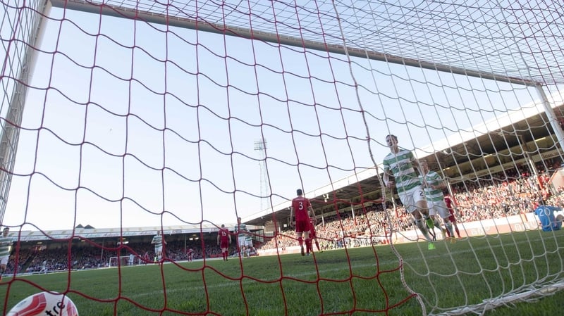 Celtic's Stefan Johansen scores the visitors' equaliser at Pittodrie