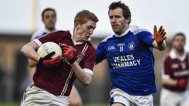 Slaughtneil's Christopher Bradley shields the ball from Cavan Gael's Michael Lyng at Owenbeg