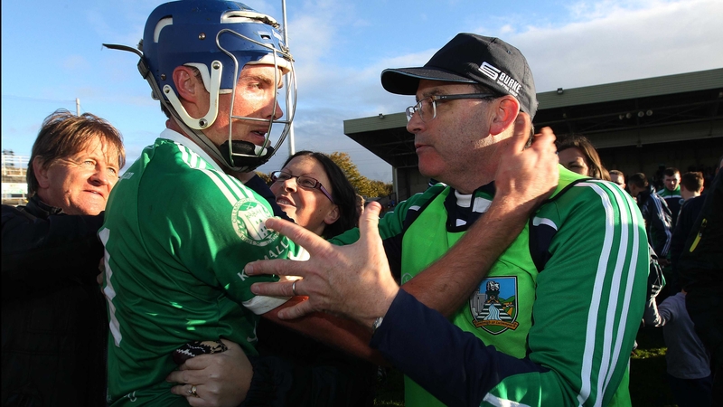 Kilmallock star Gavin O'Mahony and manager Ger O'Loughlin celebrate in Limerick