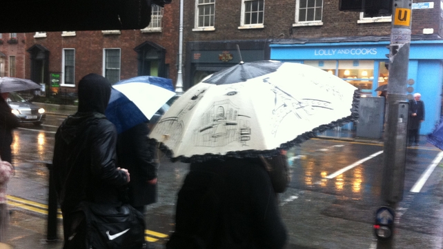 People brave the heavy rain in Dublin city today