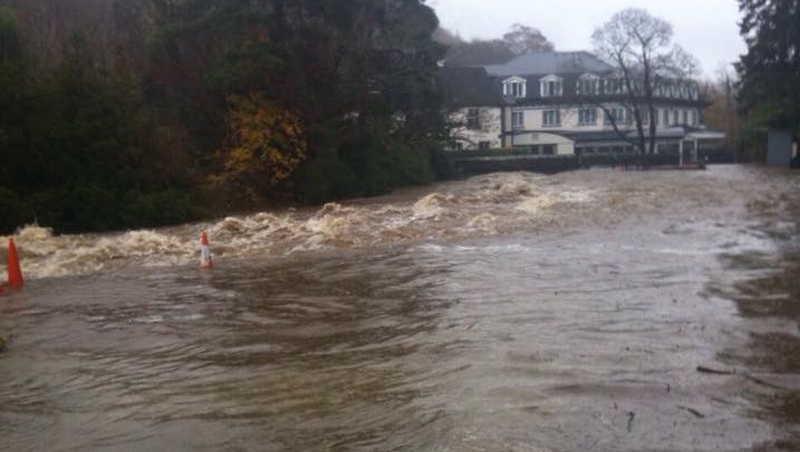 A river overflows onto a road in Glendalough, Co Wicklow (pic: Tara McDonald)