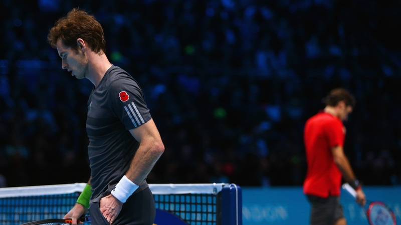Andy Murray looks on in the round robin singles match against Roger Federer