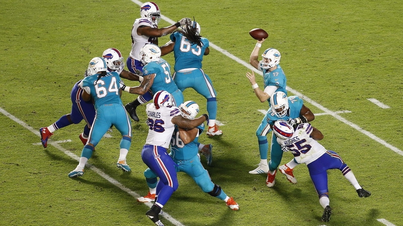 Quarterback Ryan Tannehill of the Miami Dolphins throws against the Buffalo Bills in the third quarter in a game at Sun Life Stadium