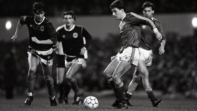 John Aldridge evades the challenge of Alan Hansen