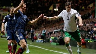 Ireland's Stephen Ward with Steven Whittaker of Scotland