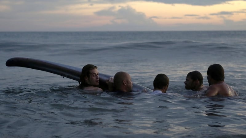 People try to help the whale into deeper water