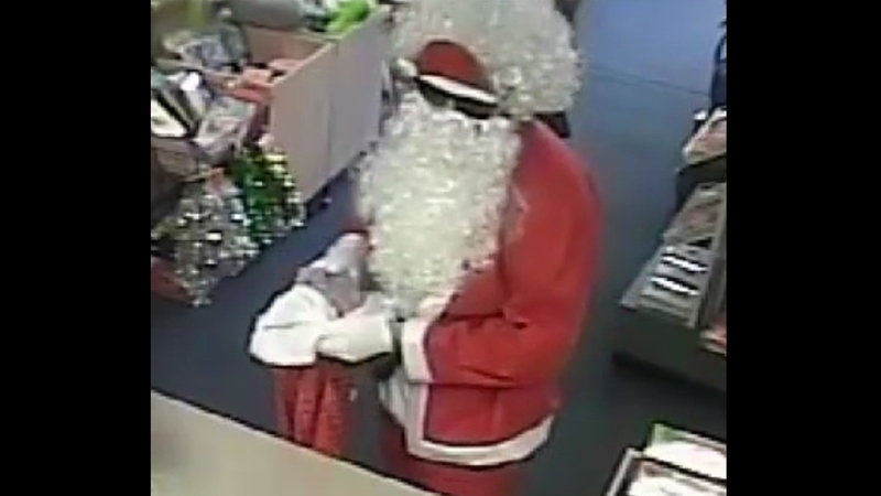 The man entered the Snell Grove post office in Oak Park this morning disguised as Santa