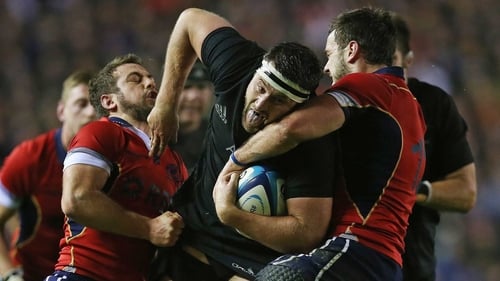 New Zealand's Jeremy Thrush is tackled by Scotland's Greig Laidlaw and Alex Dunbar