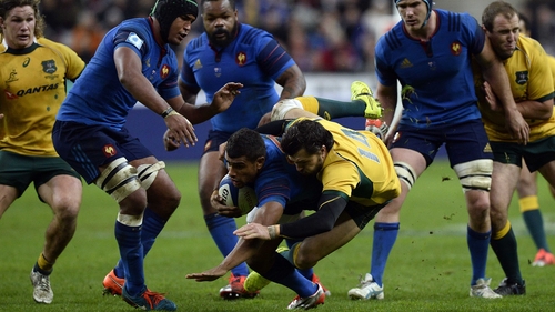 Australia's Adam Ashley-Cooper (R) tackles France's centre Wesley Fofana
