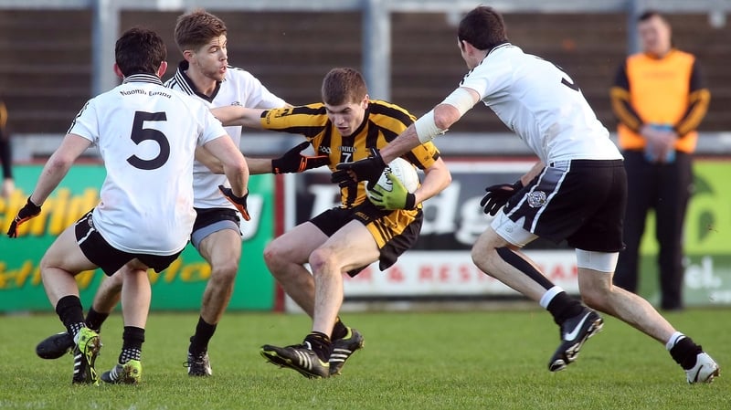 St Eunan's Darragh Mulgrew is swarmed by St Enda's Ciaran McLaughlin, Aaron Grugan and Justin McMahon