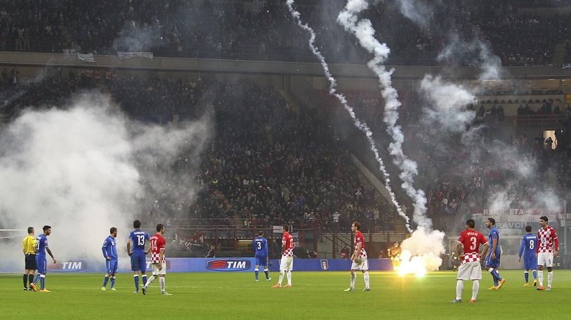 Play was stopped in Milan after fireworks were thrown onto the pitch by the Croatia fans