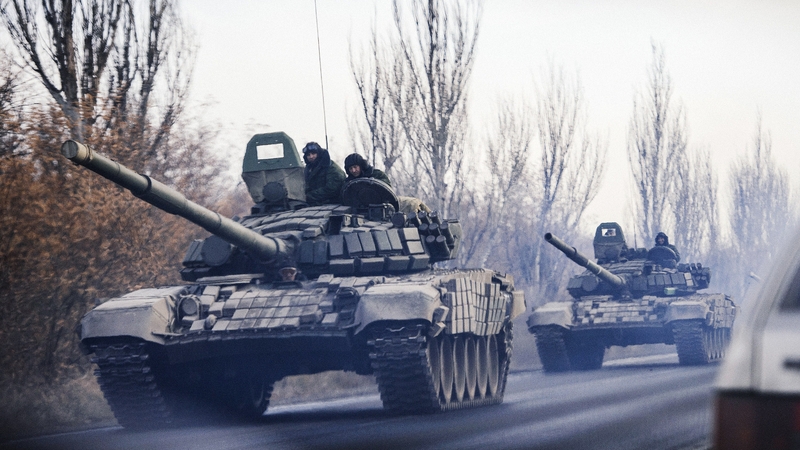A column of tanks drive from a rebel-territory to Donetsk near the town of Shakhtarsk, eastern Ukraine