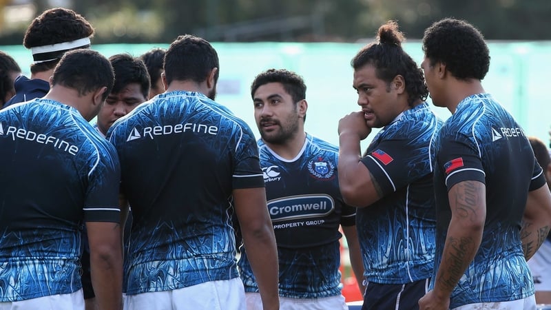 Census Johnston (secnd right) talks to his team-mates in training