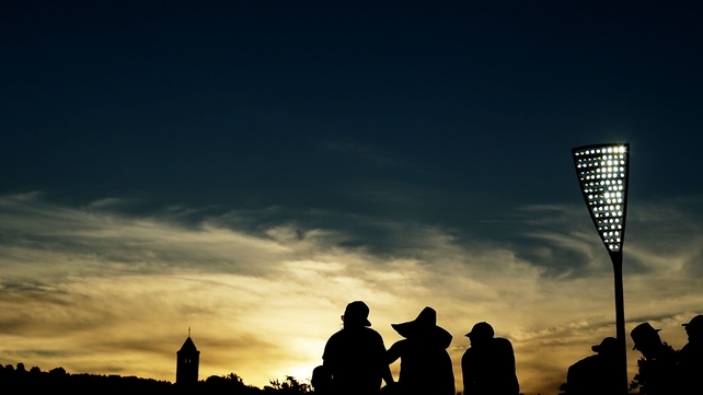 Spectators watch game three of the One Day International Series between Australia and South Africa at Manuka Oval on Wednesday