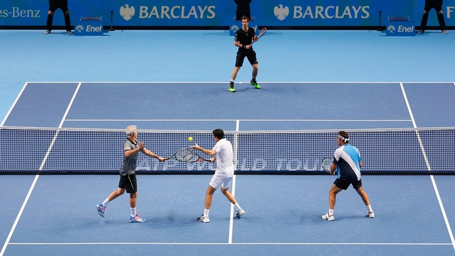 Andy Murray of Great Britain plays against John McEnroe, Tim Henman and Pat Cash in the exhibition match on day eight of the Barclays ATP World Tour Finals at O2 Arena in London on Saturday