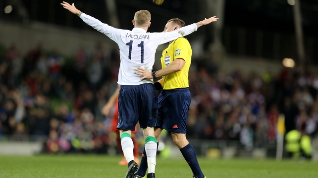 James McClean bumps into the referee Pawel Raczkowski as he celebrates scoring during Ireland's friendly against the USA on Tuesday