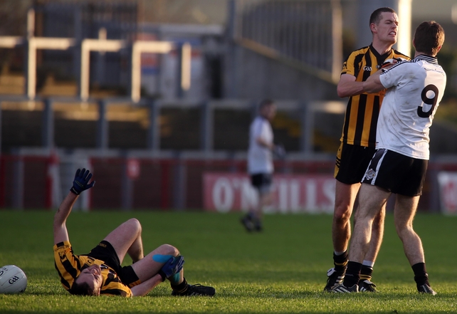 St Eunan's Kevin Rafferty confronts St Enda's Conan Grugan after his foul on Mark McGowan during the Ulster club SFC semi-final