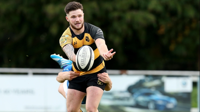 Young Munster's Dan Goggin with Marcus O'Driscoll of Mary's during their UBL game on Saturday