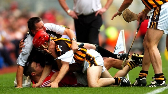 Walsh has Cork's Niall McCarthy, and linesman Brian Gavin for company during the 2008 All-Ireland semi-final