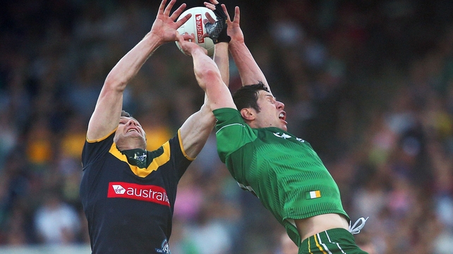 Patrick Dangerfield and Sean Cavanagh contest a high ball