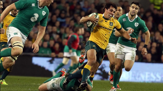 Nick Phipps breaks through the Irish defence for one of his two tries in reply