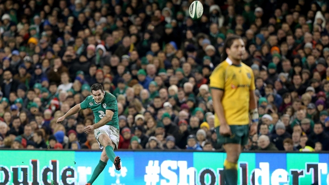 Jonathan Sexton kicks for goal...