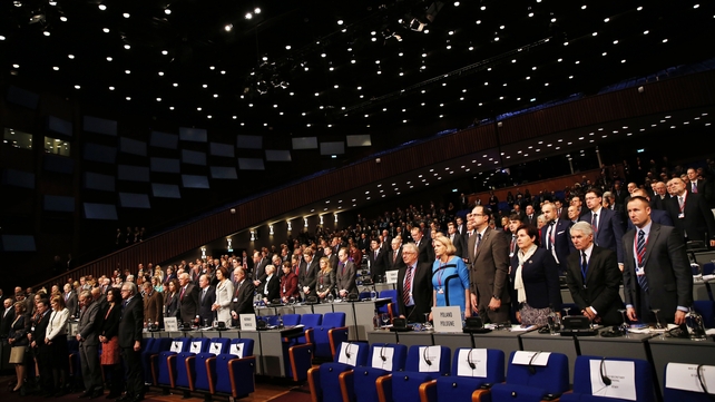 Delegates hold a minute's silence for the victims of the MH17 plane crash before the start of the NATO Parliamentary Assembly 60th Annual Session in The Hague