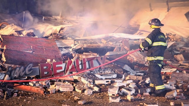 A fire is extinguished after a beauty salon was set ablaze in Ferguson