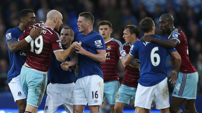 James Collins of West Ham United confronts Everton's James McCarthy at Goodison Park last weekend
