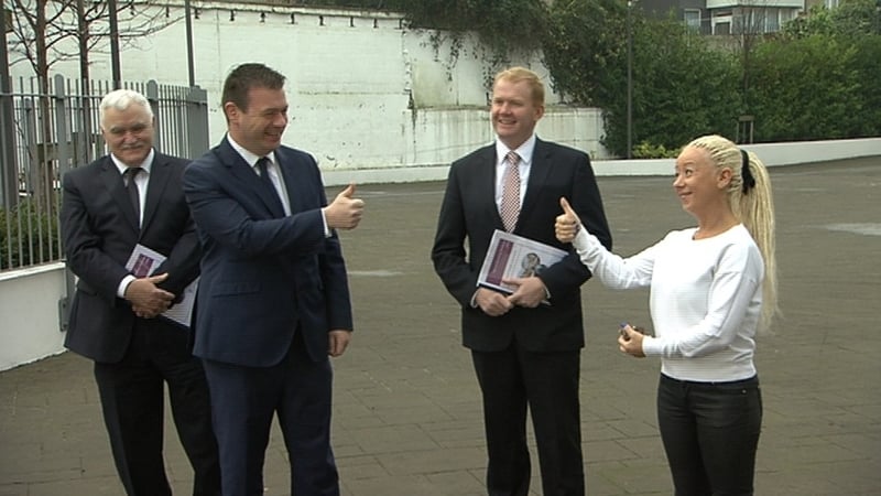 Minister Alan Kelly, second from left, with housing co-op member Justine Reilly, right, at the launch of the strategy in Inchicore